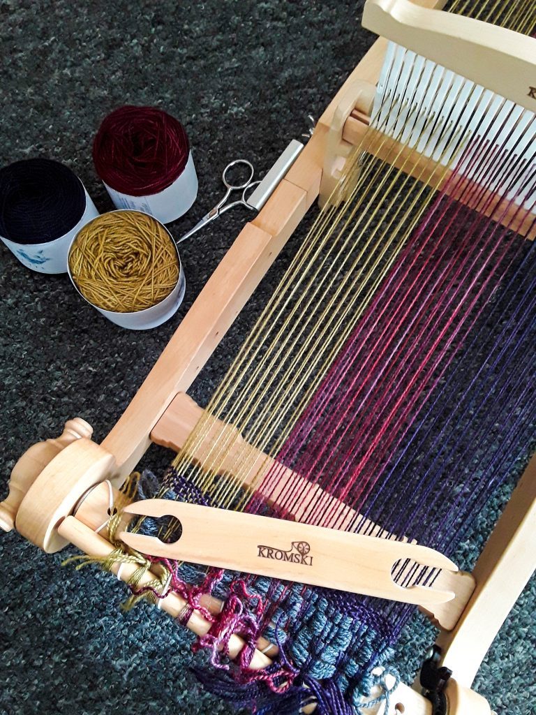 A warped kromski loom using hand dyed yarn 