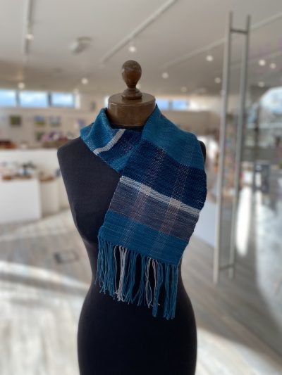 Hand woven scarf made with hand dyed yarn on a rigid heddle loom at our weave a scarf workshop