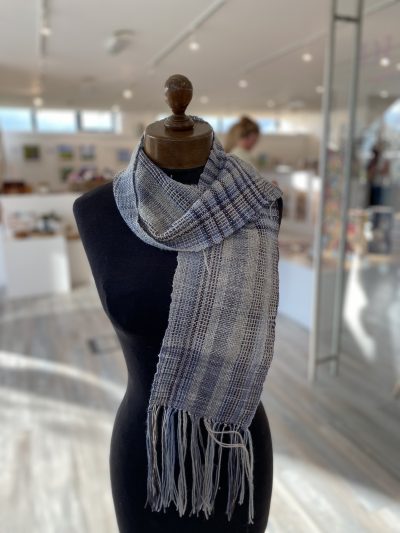Hand woven scarf made by a beginner at our Weave a Scarf Workshop with hand dyed yarn on a rigid heddle loom
