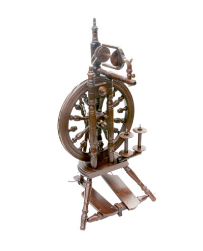 kromski minstrel spinning wheel with double treadle and built in lazykate. In walnut finish