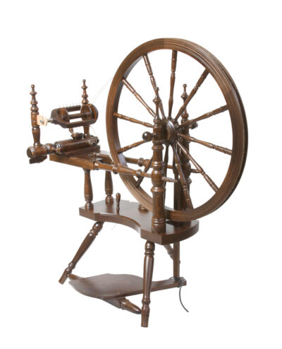 Kromski polonaise spinning wheel with single treadle and double drive band. Walnut finish